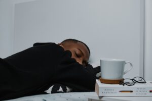 man sleeping on the desk